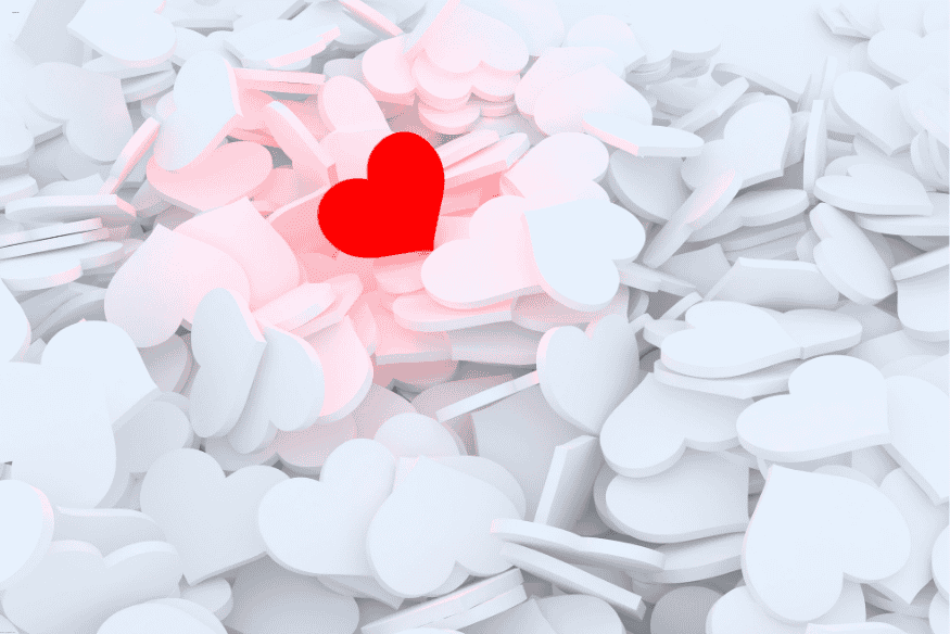 Corações brancos em 3D com um coração vermelho no centro, representando destaque de emoções positivas.